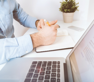 Man Sitting At A Computer